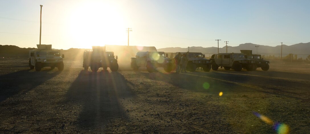 Humvees parked in the ATSO (ability to survive and operate) compound during a Prime Beef exercise at Luke Air Force Base, Ariz., Nov. 17, 2016. The exercise reinforced skills in self-aid buddy care, gathering intelligence, countersign, and defensive fighting positions. (U.S. Air Force photo by Senior Airman James Hensley)
