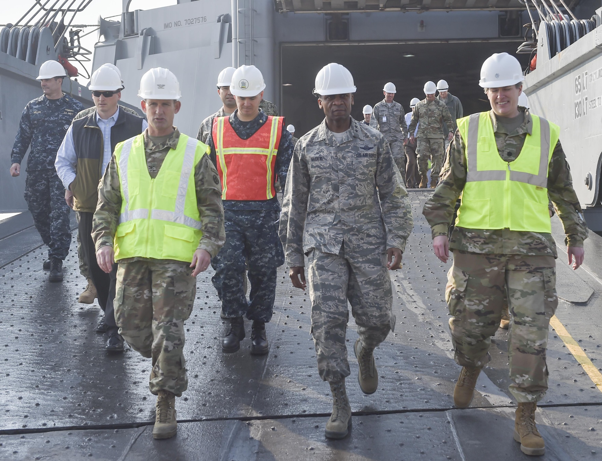 U.S. Air Force Gen. Darren W. McDew, U.S. Transportation Command commander, center, exits MV Cape Edmund (AKR-5069) Nov.16, 2016, at Joint Base Charleston - Weapons Station, South Carolina. The tour showcased Joint Task Force Port Opening for seaport of debarkation capabilities. The tour was part of the U.S. TRANSCOM Component Commanders conference.