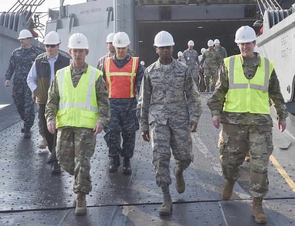 U.S. Air Force Gen. Darren W. McDew, U.S. Transportation Command commander, center, exits MV Cape Edmund (AKR-5069) Nov.16, 2016, at Joint Base Charleston - Weapons Station, South Carolina. The tour showcased Joint Task Force Port Opening for seaport of debarkation capabilities. The tour was part of the U.S. TRANSCOM Component Commanders conference.