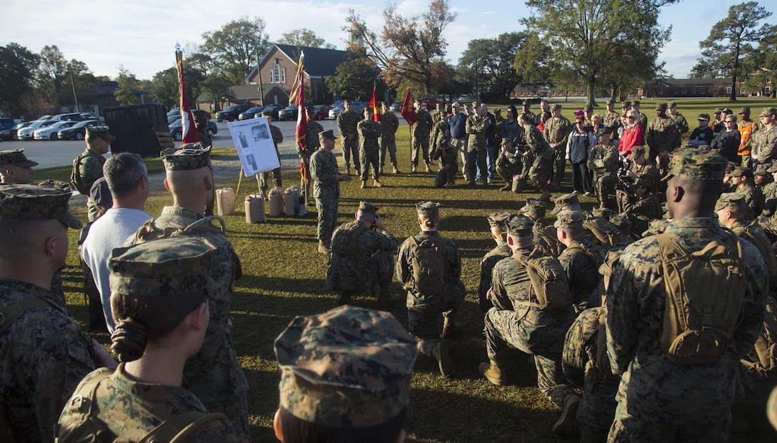 U.S. Marine Corps Staff Sgt. Markus Green, front left, career planner, Headquarters and Support Battalion (H&S Bn), Marine Corps Installations East, Marine Corps Base Camp Lejeune
(MCIEAST, MCB CAMLEJ) gives a period of military instruction during a hike on Camp Lejeune, Nov. 14, 2016. H&S Bn, MCIEAST, MCB CAMLEJ conducted a 7.5 mile motivational and
educational hike in recognition of the 75th anniversary of Camp Lejeune.