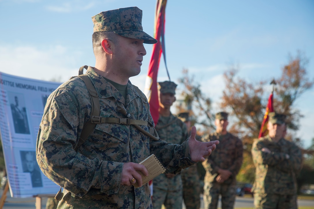 U.S. Marine Corps Staff Sgt. Markus Green, front left, career planner, Headquarters and Support Battalion (H&S Bn), Marine Corps Installations East, Marine Corps Base Camp Lejeune
(MCIEAST, MCB CAMLEJ) gives a period of military instruction during a hike on Camp Lejeune, Nov. 14, 2016. H&S Bn, MCIEAST, MCB CAMLEJ conducted a 7.5 mile motivational and
educational hike in recognition of the 75th anniversary of Camp Lejeune.