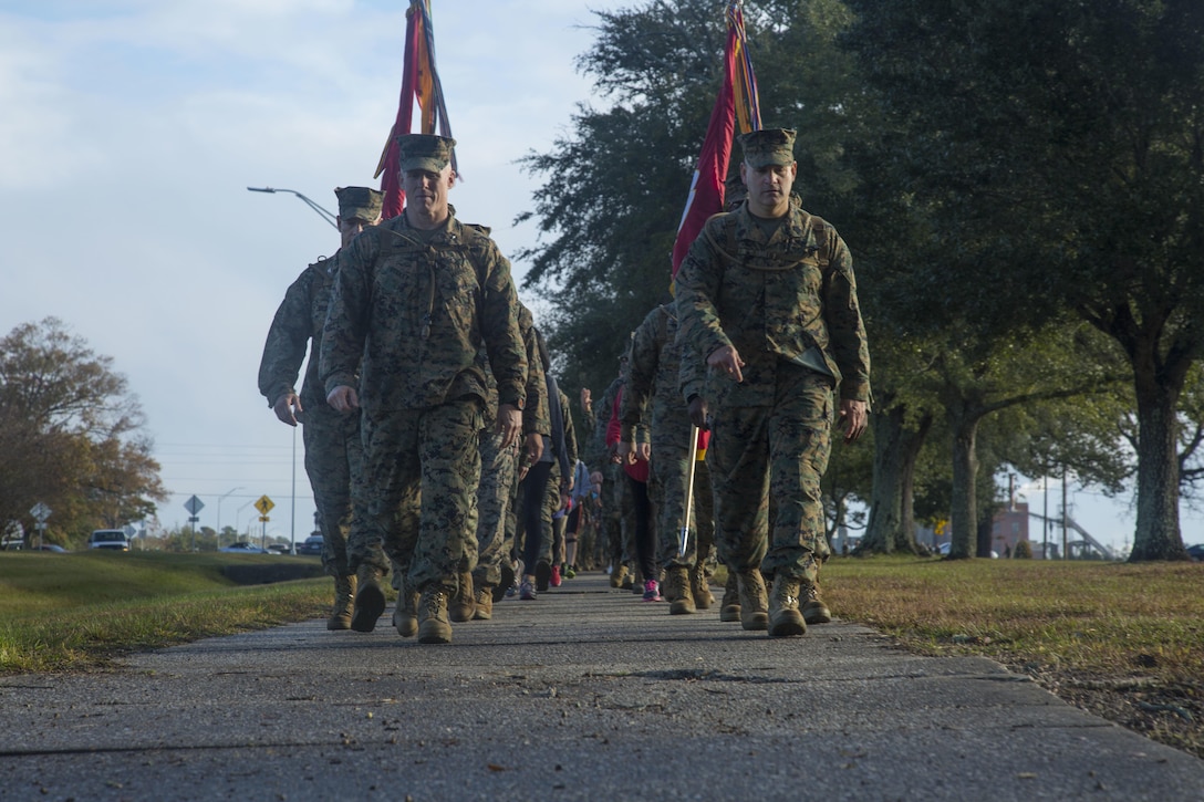 U.S. Marines with Headquarters and Support Battalion (H&S Bn), Marine Corps Installations East, Marine Corps Base Camp Lejeune (MCIEAST, MCB CAMLEJ) conduct a hike on Camp Lejeune, Nov. 14, 2016. H&S Bn, MCIEAST, MCB CAMLEJ conducted a 7.5 mile motivational and educational hike in recognition of the 75th anniversary of Camp Lejeune.