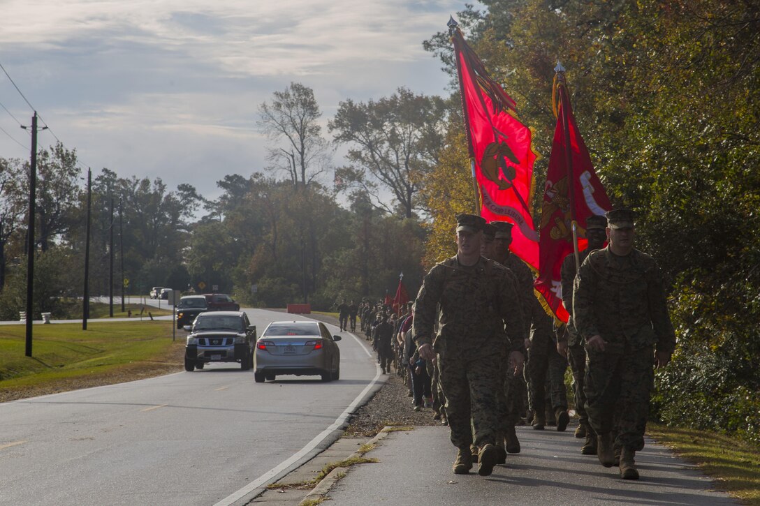 U.S. Marines with with Headquarters and Support Battalion (H&S Bn), Marine Corps Installations East, Marine Corps Base Camp Lejeune (MCIEAST, MCB CAMLEJ) conduct a hike on Camp
Lejeune, Nov. 14, 2016 .H&S Bn, MCIEAST, MCB CAMLEJ conducted a 7.5 mile motivational and educational hike in recognition of the 75th anniversary of Camp Lejeune.