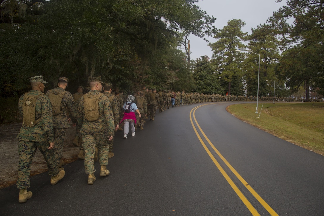 U.S. Marines with with Headquarters and Support Battalion (H&S Bn), Marine Corps Installations East, Marine Corps Base Camp Lejeune (MCIEAST, MCB CAMLEJ) conduct a hike on Camp
Lejeune, Nov. 14, 2016. H&S Bn, MCIEAST, MCB CAMLEJ conducted a 7.5 mile motivational and educational hike in recognition of the 75th anniversary of Camp Lejeune.
