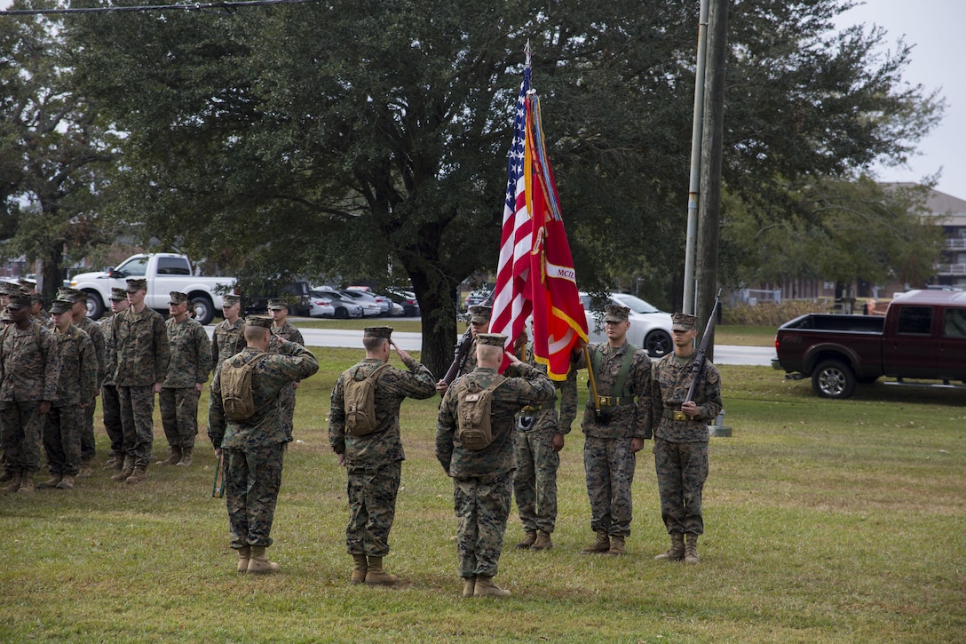 U.S. Marine Corps Sgt. Maj. Scott Grade, left, sergeant major, Marine Corps Installations East, Marine Corps Base Camp Lejeune (MCIEAST, MCB CAMLEJ), Col. Chandler Seagraves, center, commanding officer, headquarters and Support Battalion (H&S Bn), MCIEAST, MCB CAMLEJ, and Brig. Gen. Thomas Weidley, commanding general, MCIEAST, MCB CAMLEJ, salute the colors during a ceremony on Camp Lejeune, Nov. 14, 2016. H&S Bn, MCIEAST, MCB CAMLEJ conducted a 7.5 mile motivational and educational hike in recognition of the 75th anniversary of of Camp Lejeune.