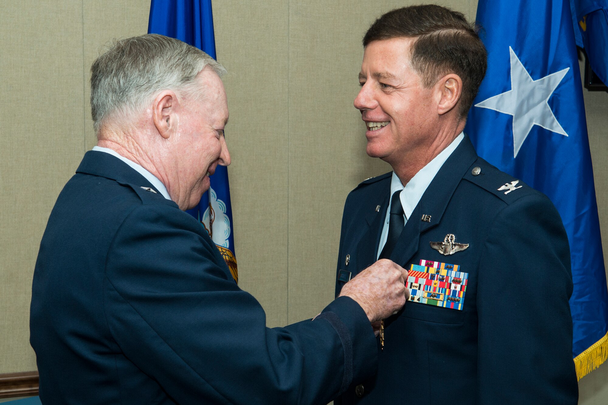 U.S. Air Force retired Brig. Gen. Jack Ihle, former 307th Bomb Wing commander, presents The Legion of Merit medal to Col. Keith Schultz during a retirement ceremony on Nov. 18, 2016, Barksdale Air Force Base, La. Schultz, the former 307th Operations Group commander, is a B-52H Stratofortress pilot and is retiring after serving more than 30 years in the Air Force. (U.S. Air Force photo by Master Sgt. Greg Steele/Released)