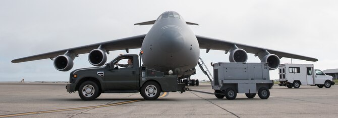 Senior Airman Thomas Ribeiro, 60th Aerospace Ground Equipment Flight mechanic, retrieves a generator from a C-5M Super Galaxy maintenance crew at Travis Air Force Base, Calif., on  Nov. 15, 2016. Ribeiro has worked in as a mechanic and dispatcher with his unit for the past five years, providing ground equipment that is critical to aircrews providing rapid global mobility for the Air Force and the Department of Defense. (U.S. Air Force photo by Ken Wright)