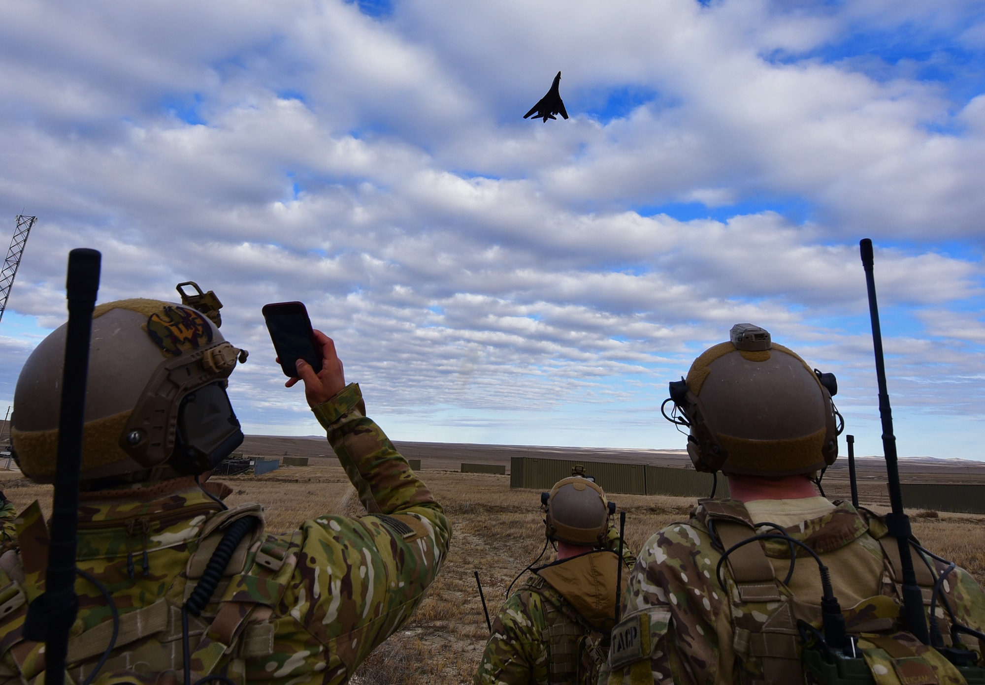 A B-1 bomber from Ellsworth Air Force Base, S.D., performs a show-of-force flyover as part of a joint-exercise rescue near Belle Fourche, S.D., Nov. 16, 2016. Combat Raider 1701 is a joint-exercise to maintain interoperability between air support and ground troops. (U.S. Air Force photo by Airman 1st Class James L. Miller) 