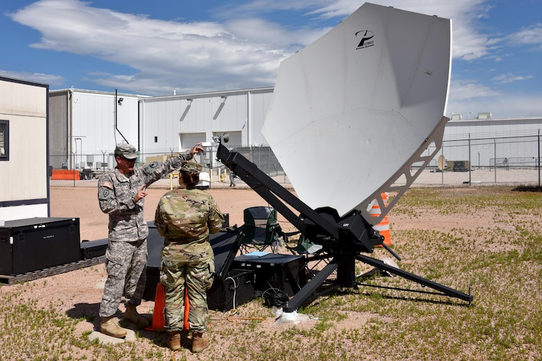COLORADO SPRINGS, Colo. - Army Sgt. 1st Class Taylor Michelsen, a space control training instructor with the U.S. Army Space and Missile Defense School House, teaches Spc. Jenna M. Goodwin, 1st Space Brigade, how to determine and adjust the polarization of the Patriot antenna during the Army Space Control Fundamentals course in Colorado Springs, Colo, Aug. 10, 2016. (U.S. Army photo by Dottie White)
