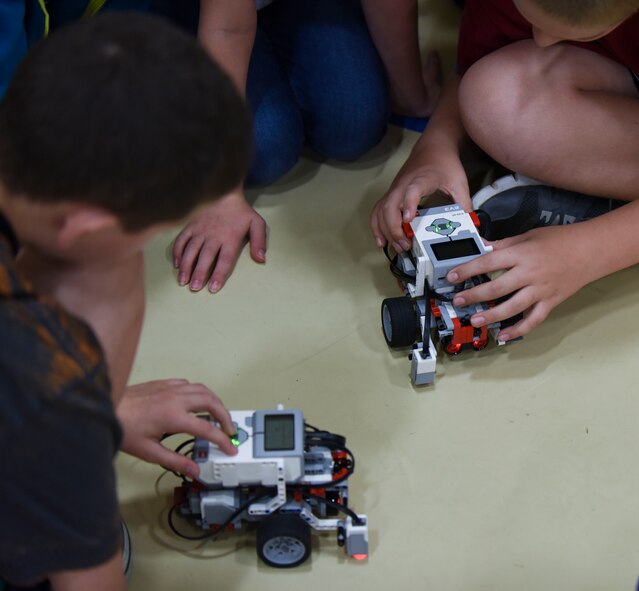 Barksdale youth program commands for their robot at the youth center at Barksdale Air Force Base, La., Nov. 12, 2016. The goal was to program the robots to run a certain path that was marked on the floor. (U.S. Air Force photo/Airman 1st Class Stuart Bright)