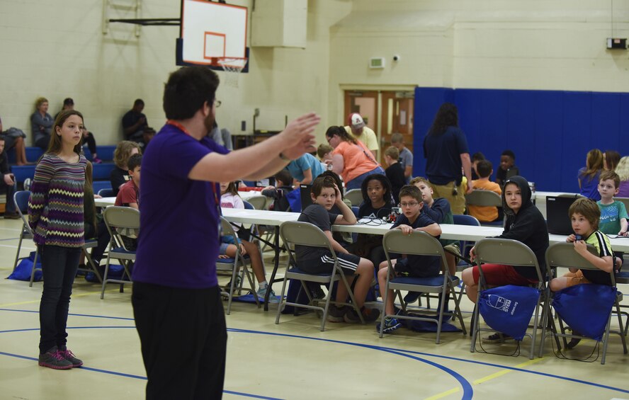 Barksdale youth program commands for their robot at the youth center at Barksdale Air Force Base, La., Nov. 12, 2016. The goal was to program the robots to run a certain path that was marked on the floor. (U.S. Air Force photo/Airman 1st Class Stuart Bright)