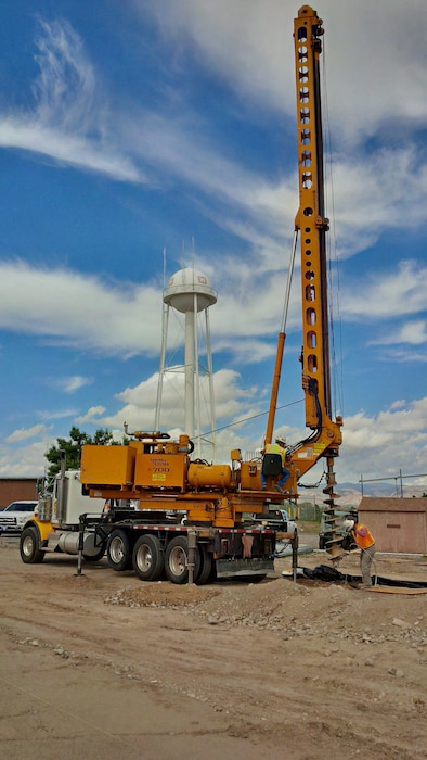 COCHITI LAKE, N.M. – A worker drills while installing a photovoltaic electric generation system at the project, Sept. 14, 2016. Photo by Erin Larivee. This was a 2016 Photo Drive entry.