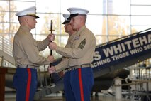 The 9th Marine Corps District commanding officer, Col. Jason Morris, and Sgt. Maj. John S. Hawes, pass the noncommissioned officer sword during the relief and appointment ceremony aboard Naval Station Great Lakes, Ill., on Nov. 18, 2016. The emblematic passing of the sword of office signifies the transfer of sacred trust from one sergeant major to another. (U.S. Marine Corps photo by Cpl. Zachery Martin/Released)