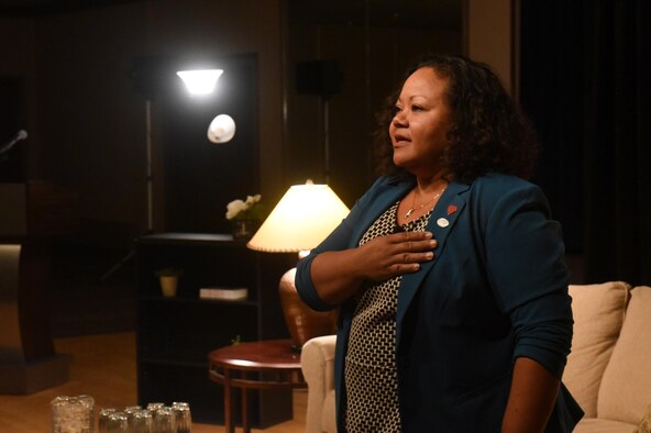 PETERSON AIR FORCE BASE, Colo. – Michelle Mras sings part of “America the Beautiful” during her presentation during the Storytellers event held at The Club on Peterson Air Force Base, Colo., Nov. 2, 2016. Mras shared how her experiences growing up in a military family in the Philippines and as a military spouse fueled her love for America and its armed forces. (U.S. Air Force photo by Dave Meade)