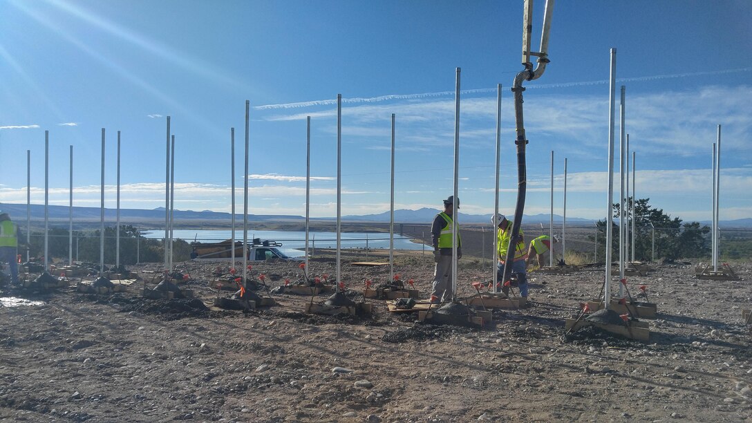 COCHITI LAKE, N.M. – Workers construct the framework for a photovoltaic electric generation system at the project, Sept. 26, 2016. Photo by Erin Larivee. This was a 2016 Photo Drive entry.