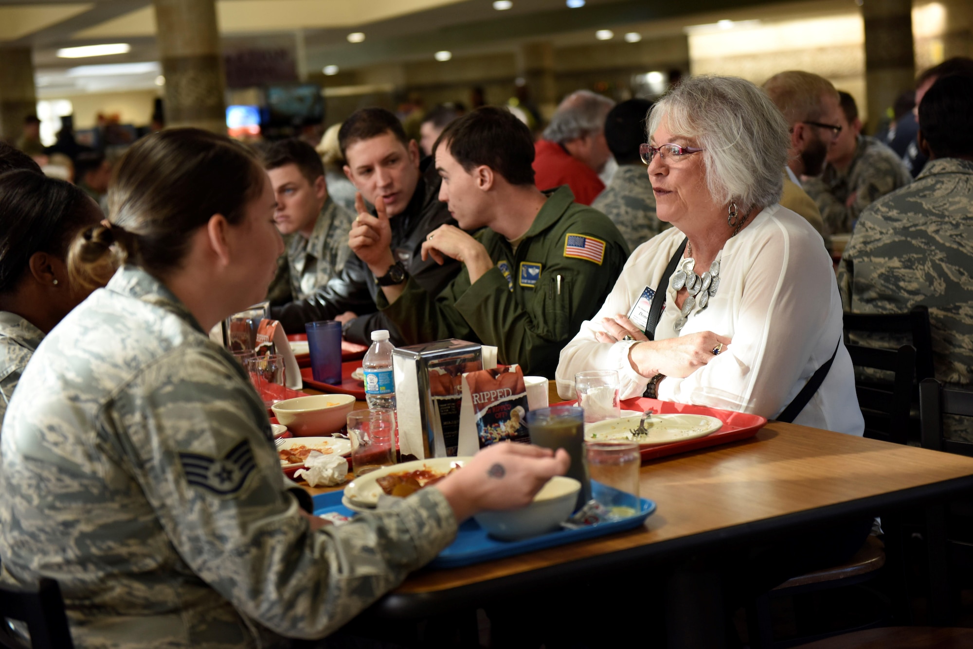 Donna L. Wolfe-Sholes, an AMC civic leader representing Grand Forks Air Force Base, N.D., visits with Airmen from the 43rd Air Mobility Operations Group on Pope Army Airfield, N.C. Nov. 16, 2016. The visit was part of the AMC civic leader tour of the AMC mission at Pope AAF.  The tour provided insight into AMC’s prominent role enabling joint mission effects globally. (U.S. Air Force photo by Master Sgt. Kristine Dreyer)