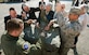 Maj. Gen. Thomas Sharpy, AMC vice commander, works with AMC civic leaders to build a Container Delivery System bundle, Nov. 16, 2016 during a civic leader tour at the 43rd Operations Support Squadron at Pope Army Airfield, N.C. The visit was part of the AMC civic leader tour of the AMC mission at Pope AAF.  The tour provided insight into AMC’s prominent role enabling joint mission effects globally. (U.S. Air Force photo by Marc Barnes)