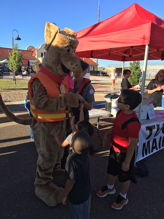 TUCUMCARI, N.M. – Bobber the water safety dog attends the Fired Up event here along with Conchas park ranger Taylor Atwood, Sept. 24, 2016. Bobber talked to many people during the event about the importance of always wearing a life jacket when near the water. Photo by Nadine Carter. This was a 2016 Photo Drive entry.
