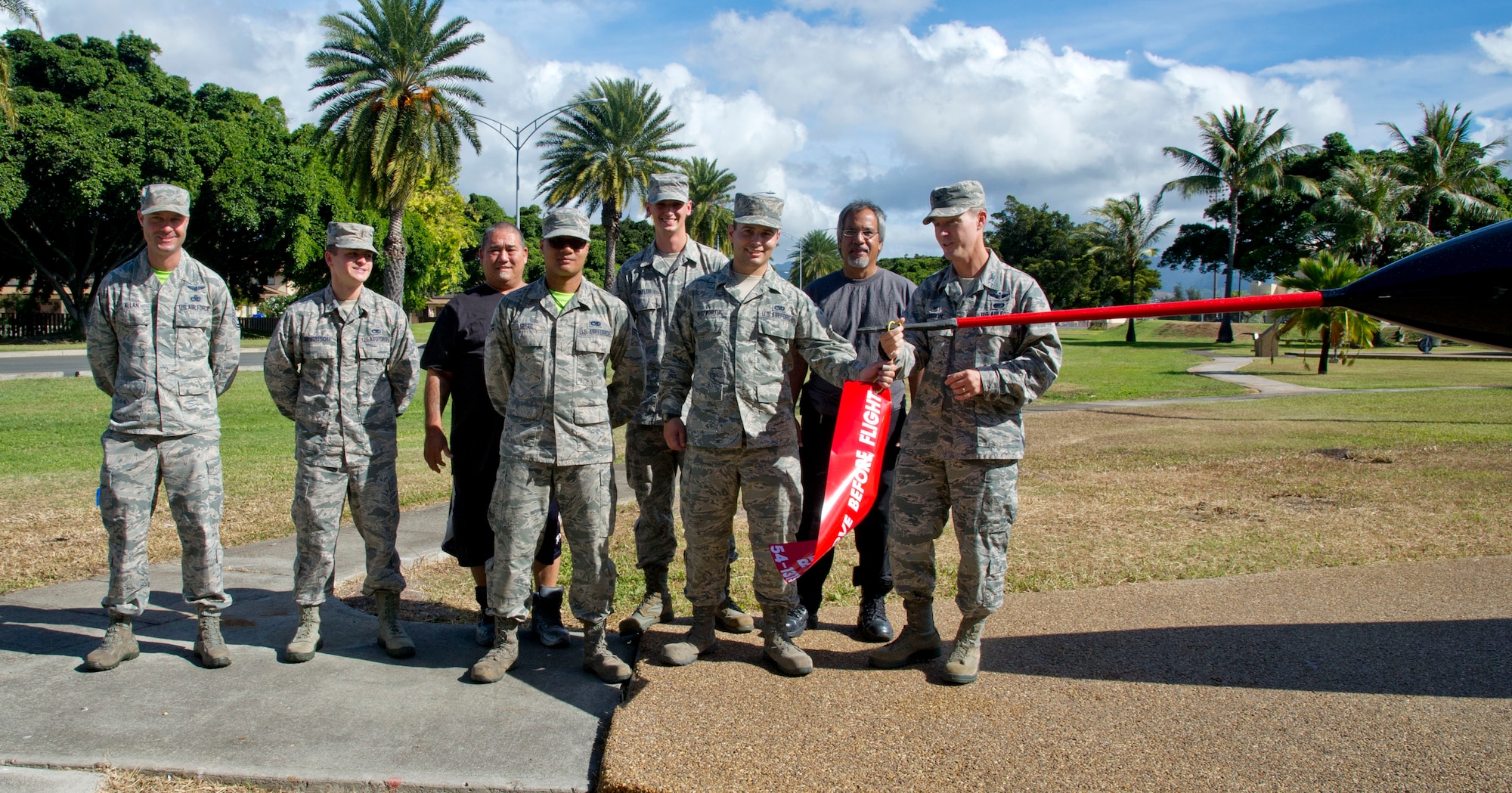 Col. Kevin Gordon, 15th Wing commander, talks to a crowd of Airmen before the ribbon cutting of the static F-102 aircraft on Joint Base Pearl Harbor-Hickam, Hawaii, Nov. 18, 2016. The aircraft recently underwent an extensive full-body restoration, which included sanding off corrosion, new paint, and new patches. Airmen from the 15th Aircraft Maintenance Squadron headed the restoration project. (U.S. Air Force photo by Tech. Sgt. Terri Paden/Released)