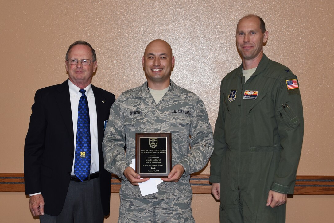 Cliff Jones, Tempe Military Affairs Committee member, and U.S. Air Force Col. Troy Daniels, 161st Air Refueling Wing commander, present the Technical Sgt. Donald Plough award to Staff Sgt. Shane Shafer during a ceremony Nov. 15, 2016 at the wing. (U.S. Air National Guard photo by Master Sgt. Kelly Deitloff)