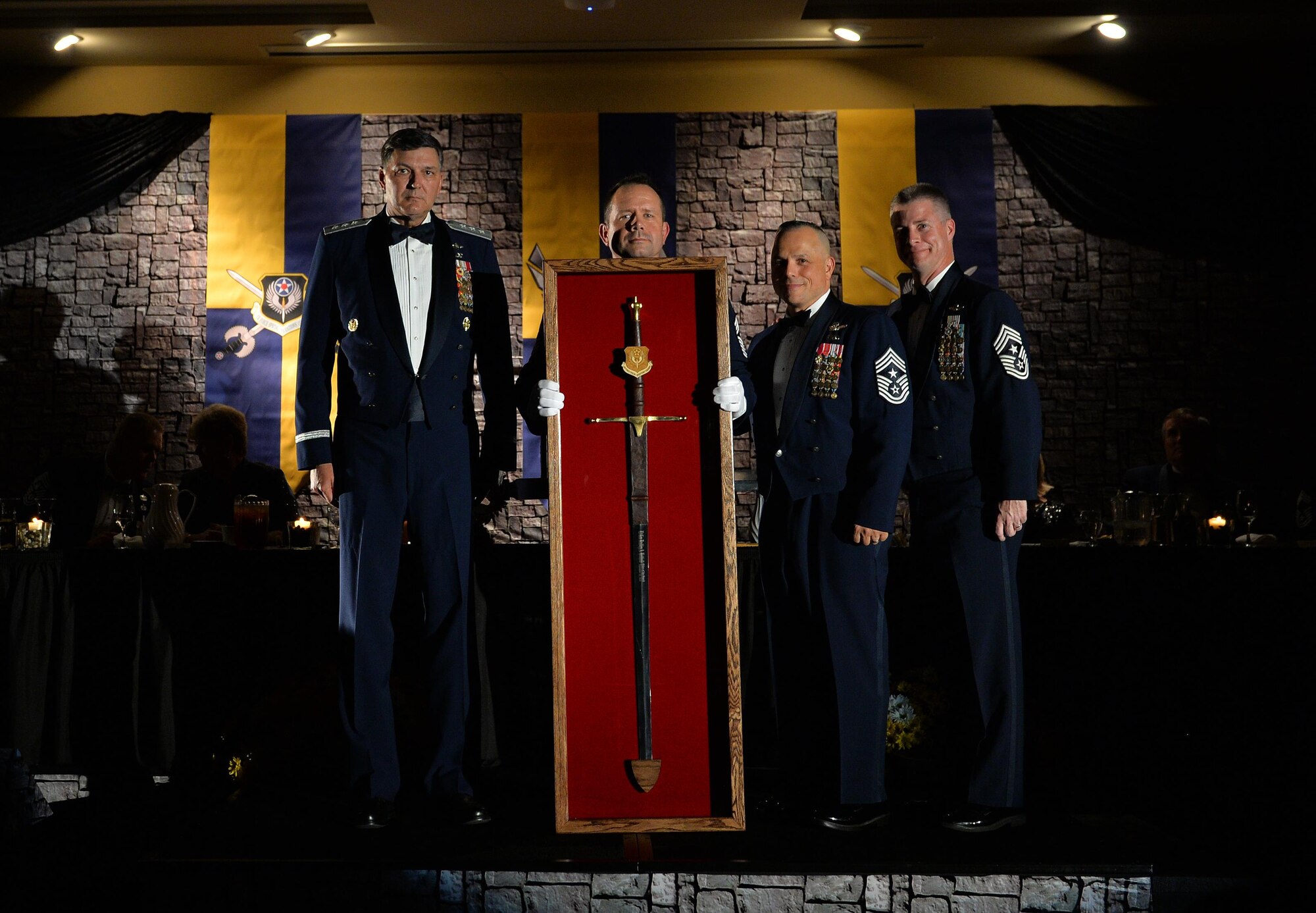 Chiefs present a sword to Lt. Gen. Brad Heithold,the former commander of Air Force Special Operations Command, as part the Order of the Sword ceremony at Hurlburt Field Fla., Nov. 18, 2016. Heithold is the 10th recipient of AFSOC’s Order of the Sword. (U.S. Air Force photo by Senior Airman Andrea Posey)