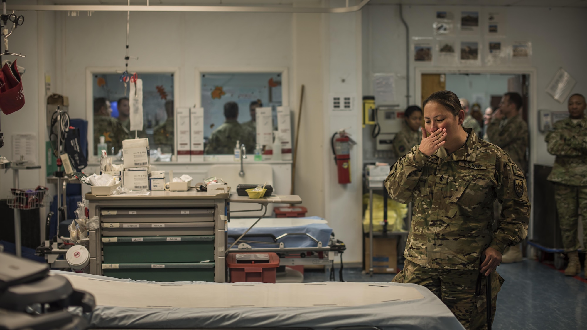 U.S. Navy Senior Chief Petty Officer Reina Hockenberry, Operation Proper Exit wounded warrior, returns to the bed she occupied while a patient at the Craig Joint Theater Hospital during a return visit to Bagram Airfield, Afghanistan Nov. 16, 2016. Hockenberry was wounded in August 2014 during an attack in Kabul and went through the CJTH before being medically evacuated. (U.S. Air Force photo by Staff Sgt. Katherine Spessa)