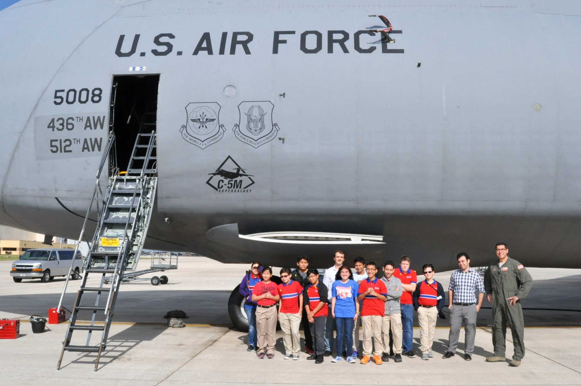 Eleven students and two teachers from the Harmony Science Academy of San Antonio receive a tour of a C-5M Galaxy during a tour Nov. 17, 2016 at Joint Base San Antonio-Lackland, Texas. The students also toured the engine, metal, and structural shops at the 433rd Airlift Wing. (U.S. Air Force photo/Senior Airman Bryan Swink)