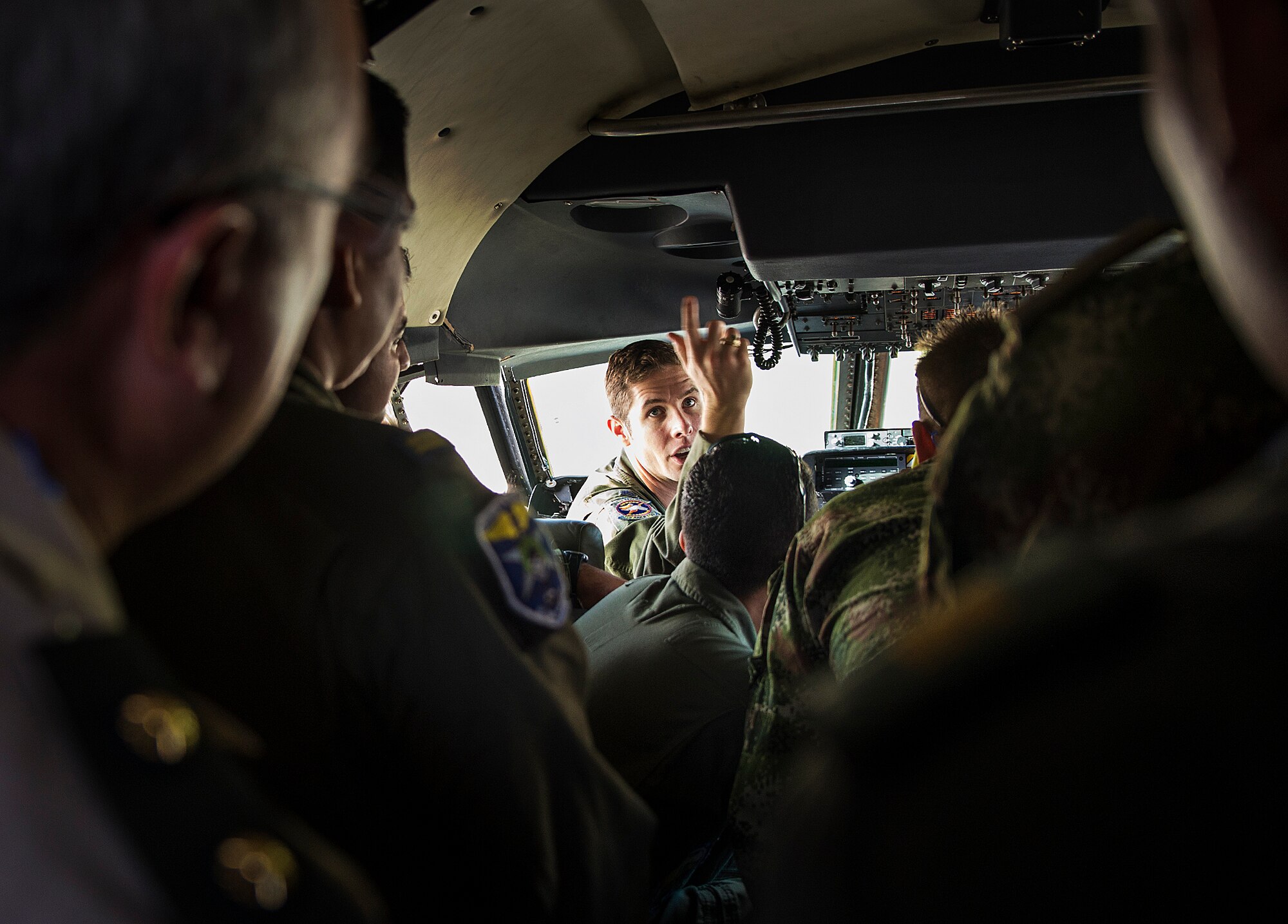 Capt. Luke Luecke, 68th Airlift Squadron pilot, explains the instrument panel on a C-5M Super Galaxy to Inter-American Air Forces Academy students Nov. 17, 2016 at Joint Base San Antonio-Lackland, Texas. The students also toured the engine, metal, and structural shops at the 433rd Airlift Wing. (U.S. Air Force photo/Benjamin Faske)