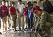 Master Sgt. Eric Mungia, 68th Airlift Squadron load master, shows students from Harmony Science Academy San Antonio the roller system that is used to move palletized cargo onto C-5M Super Galaxy aircraft Nov. 17, 2016 at Joint Base San Antonio-Lackland, Texas. The students also toured the engine, metal, and structural shops at the 433rd Airlift Wing.  (U.S. Air Force photo/Benjamin Faske)