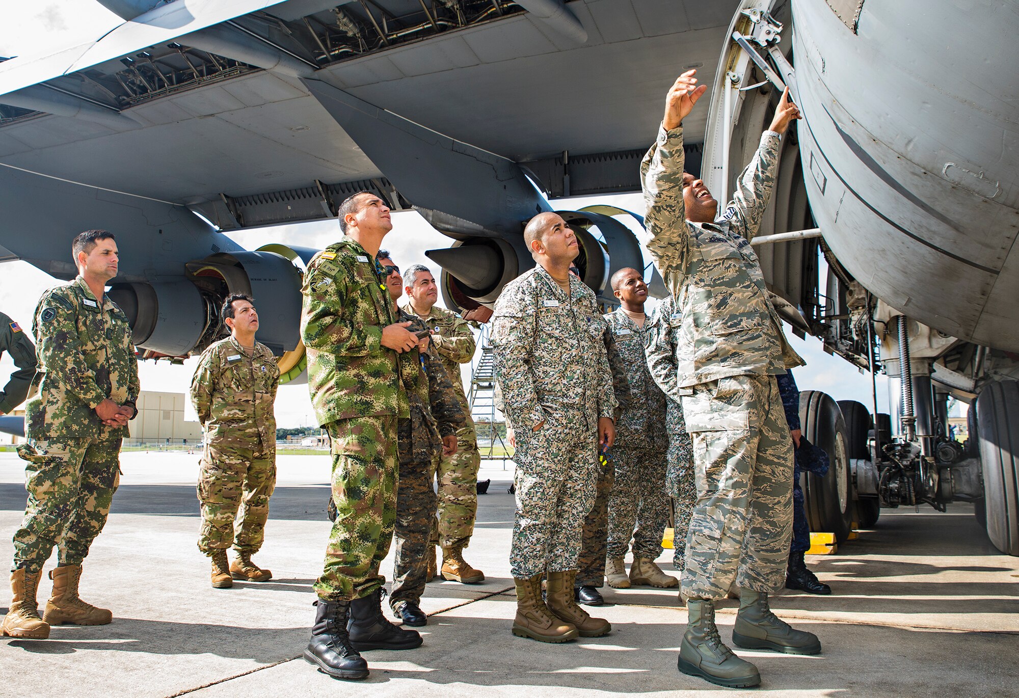 Master Sgt. Bernardo Johnson, Inter-American Air Forces Academy instructor, shows IAAFA students the outside paneling on a C-5M Super Galaxy aircraft Nov. 17, 2016 at Joint Base San Antonio-Lackland, Texas. The students also toured the engine, metal, and structural shops at the 433rd Airlift Wing.  (U.S. Air Force photo/Benjamin Faske)
