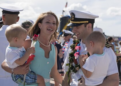 JOINT BASE PEARL HARBOR-HICKAM, Hawaii (Nov. 18, 2016) Lt. William Spears, from Pineville, Louisiana, assigned to the Los Angeles-class fast-attack submarine USS Columbia (SSN 771), is greeted by his wife and childen following the completion of a six-month deployment to the Western Pacific Ocean. (U.S. Navy photo by Petty Officer 2nd Class Michael H. Lee)