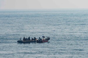 ARABIAN GULF (Nov. 18, 2016) - Sailors assigned to the guided-missile destroyer USS Nitze (DDG 94) render assistance to a distressed Iranian vessel. Nitze, deployed as part of the Eisenhower Carrier Strike Group, is supporting maritime security operations and theater security cooperation efforts in the U.S. 5th Fleet area of operations. (U.S. Navy photo by Petty Officer 3rd Class Casey J. Hopkins)

