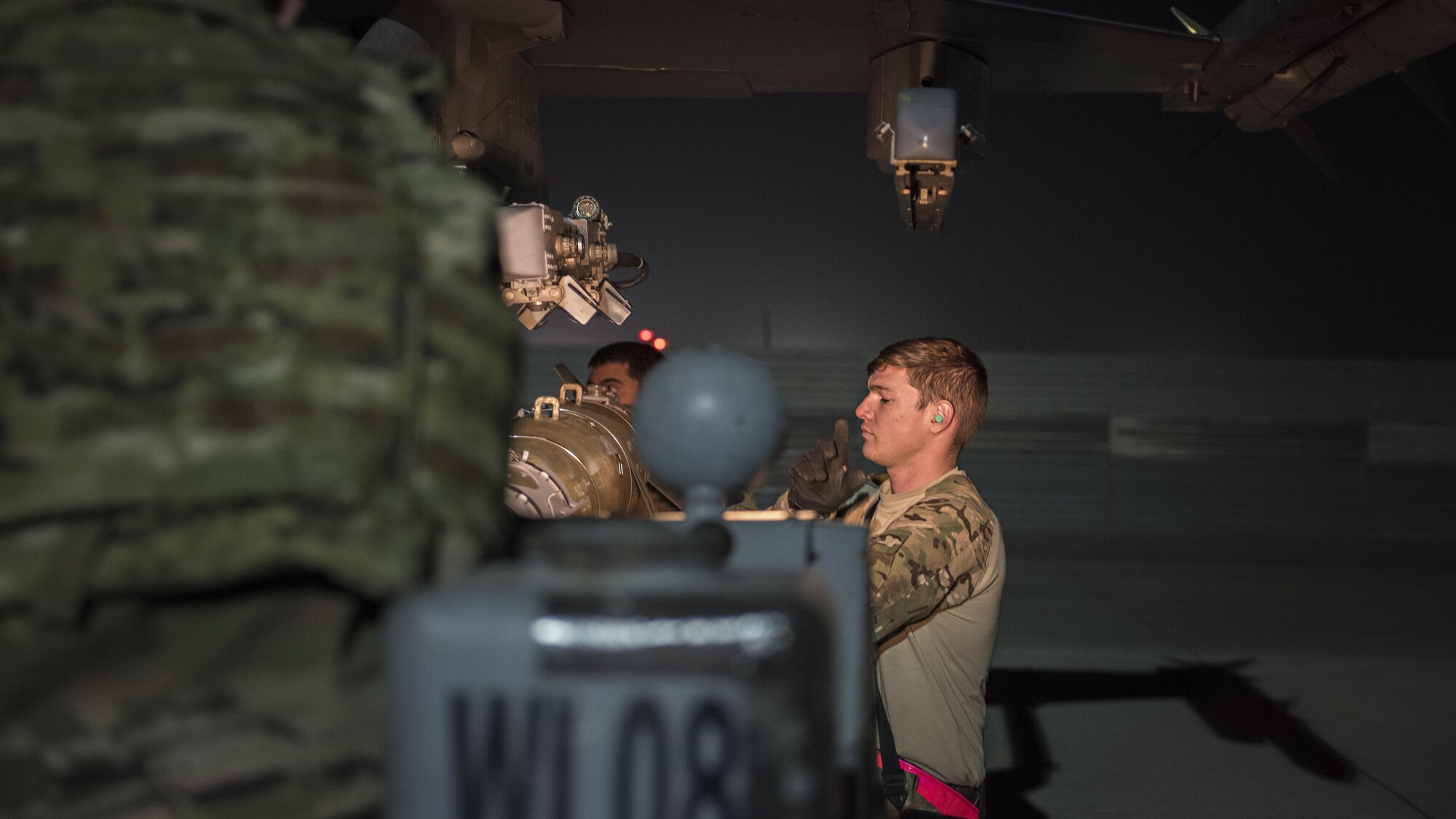 Staff Sgt. James Freeman, 455th Expeditionary Aircraft Maintenance Squadron weapons load crew chief, loads munitions onto an F-16 Fighting Falcon Nov. 15, 2016 at Bagram Airfield, Afghanistan. The F-16 employs the use of precision munitions to limit collateral damage on the battlefield. (U.S. Air Force photo by Staff Sgt. Katherine Spessa)
