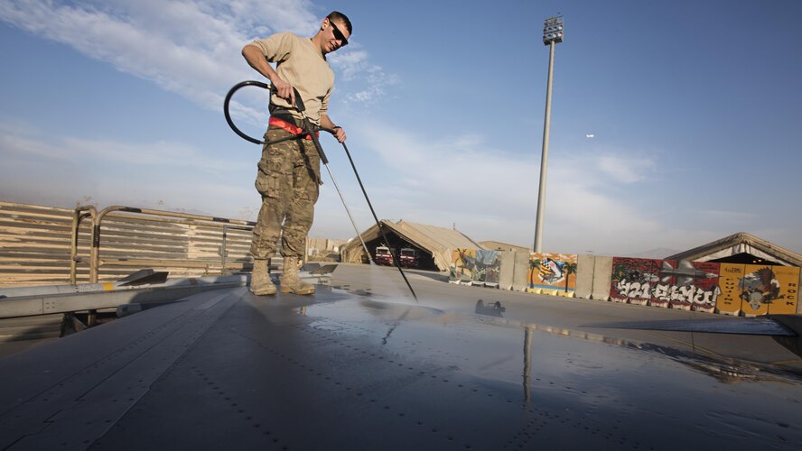 Senior Airman Daniel Lasal, 455th Expeditionary Aircraft Maintenance Squadron dedicated crew chief, washes the wing of an F-16 Fighting Falcon Nov. 15, 2016 at Bagram Airfield, Afghanistan. Dedicated crew chiefs are aircraft maintainers assigned to lead the maintenance of a specific jet. Stateside, dedicated crew chiefs have their name opposite the pilot’s on the aircraft canopy. (U.S. Air Force photo by Staff Sgt. Katherine Spessa)

