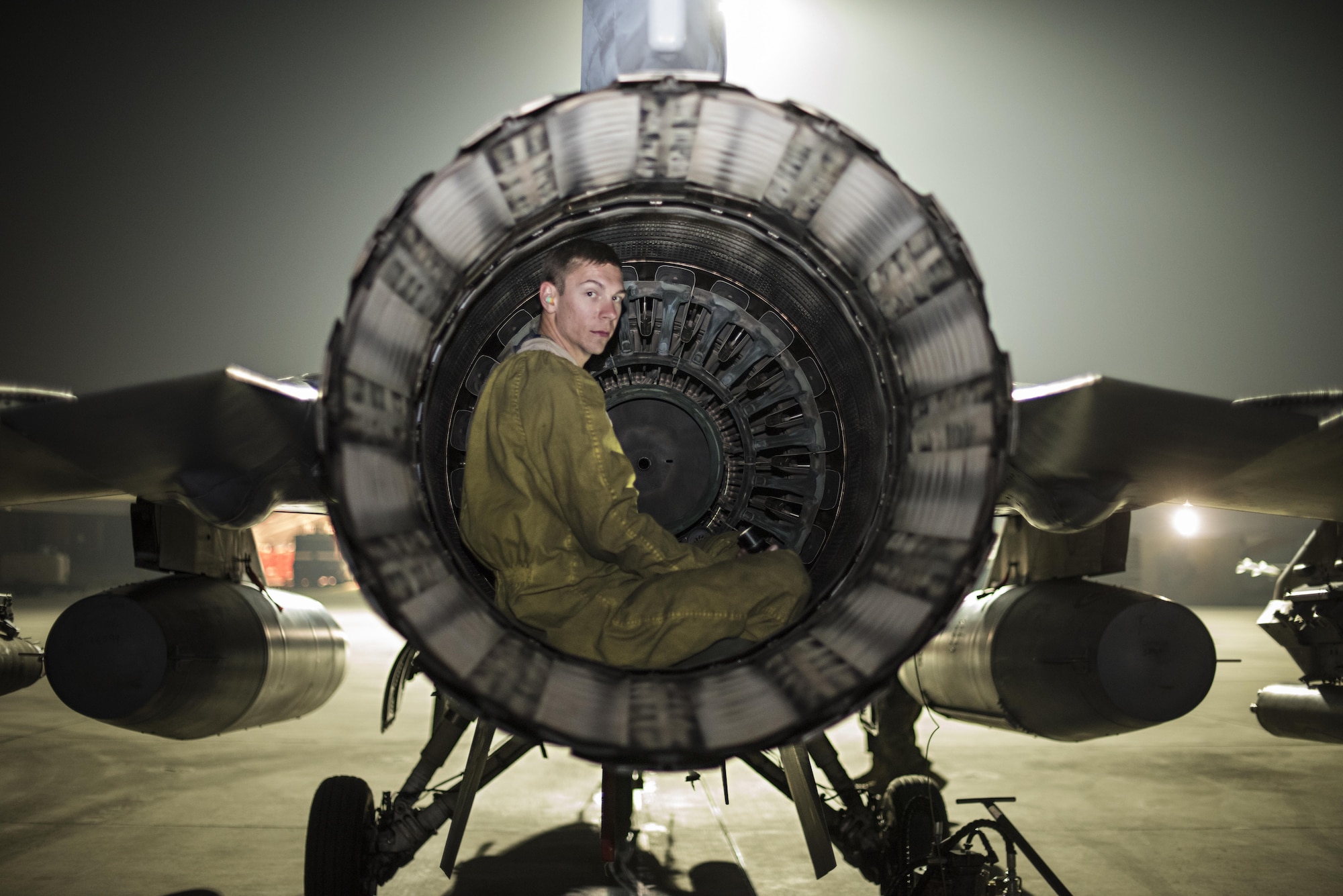 Senior Airman Daniel Lasal, 455th Expeditionary Aircraft Maintenance Squadron dedicated crew chief, performs a post-flight inspection on an F-16 Fighting Falcon Nov. 15, 2016 at Bagram Airfield, Afghanistan. Aircraft maintainers perform six-hours or more of post-flight inspections after each sortie. (U.S. Air Force photo by Staff Sgt. Katherine Spessa)