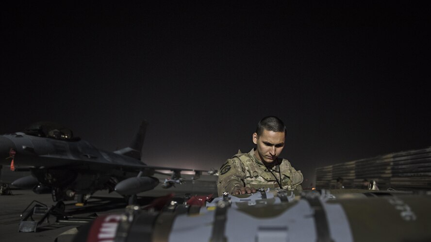 Senior Airman Zachary Manzella, 455th Expeditionary Aircraft Maintenance Squadron line delivery crew chief, delivers munitions to an F-16 Fighting Falcon Nov. 15, 2016 at Bagram Airfield, Afghanistan. Members of the 455th EAMXS enable multiple combat sorties daily out of Bagram. (U.S. Air Force photo by Staff Sgt. Katherine Spessa)
