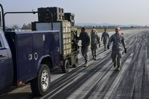 Electrical systems Airmen from the 51st Civil Engineer Squadron lay out the wiring for an emergency airfield lighting system during Prime BEEF Day at Osan Air Base, Republic of Korea, Nov. 17, 2016. The 51st CES uses the day to practice their role in how Team Osan would react to emergency situations, from loss of normal power to the base to mortar/bomb attacks on the runway, which could necessitate the use of an EALS. (U.S. Air Force photo by Senior Airman Victor J. Caputo)