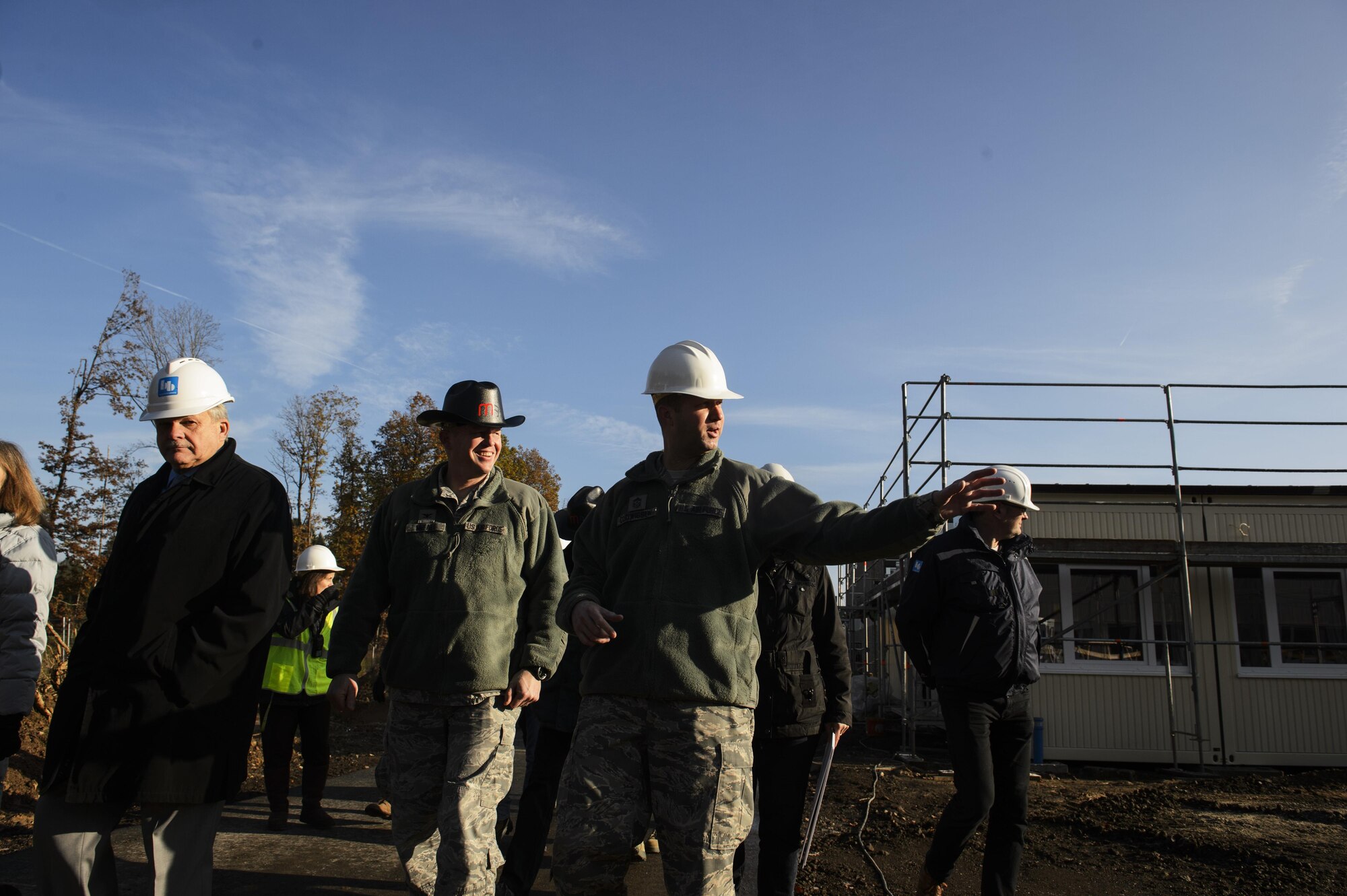 Col. Joe Mcfall, 52nd Fighter Wing commander, center left, and Chief Master Sgt. Edwin Ludwigsen, 52nd FW command chief, center right, tour around the new modular buildings being built for the elementary school on Spangdahlem Air Base, Germany, Nov. 14, 2016. The design and execution of the elementary school expansion project was a collaborative effort between Depart of Defense Education Activity, school leadership and 52nd CES. (U.S. Air Force photo by Staff Sgt. Jonathan Snyder)