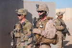 U.S Army 1st Lt. Patrick Abele, left, 1st Squadron, 75th Cavalry Regiment, Task Force Strike, and U.S. Marine Corps Master Sgt. Travis Madden , right, Special Purpose Marine Air Ground Task Force – Crisis Response – Central Command, monitor the status of a joint United States Army and United States Marine Corps readiness drill, Qayyarah West Airfield, Iraq,  Nov. 17 2016. Readiness drills provide Coalition forces with opportunities to assess their preparation and response time as they work to advise and assist the Iraqi security forces during Operation Inherent Resolve.  Coalition forces operate out of Qayyarah West Airfield where they advise and assist the Iraqi security forces as they fight to retake territory from the Islamic State of Iraq and the Levant. (U.S. Army photo by 1st Lt. Daniel Johnson)