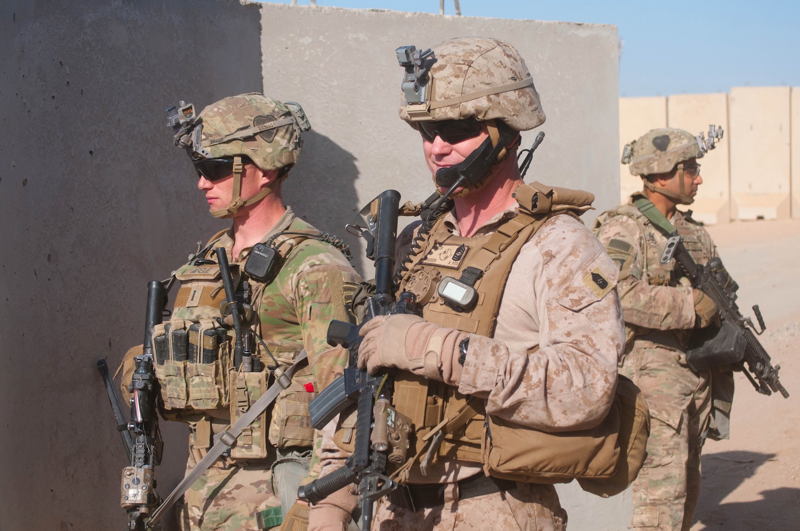 U.S Army 1st Lt. Patrick Abele, left, 1st Squadron, 75th Cavalry Regiment, Task Force Strike, and U.S. Marine Corps Master Sgt. Travis Madden , right, Special Purpose Marine Air Ground Task Force – Crisis Response – Central Command, monitor the status of a joint United States Army and United States Marine Corps readiness drill, Qayyarah West Airfield, Iraq,  Nov. 17 2016. Readiness drills provide Coalition forces with opportunities to assess their preparation and response time as they work to advise and assist the Iraqi security forces during Operation Inherent Resolve.  Coalition forces operate out of Qayyarah West Airfield where they advise and assist the Iraqi security forces as they fight to retake territory from the Islamic State of Iraq and the Levant. (U.S. Army photo by 1st Lt. Daniel Johnson)