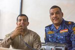 U.S. Marine Corps Cpl. Ali Mohammed, left, a member of the 3rd Battalion, 7th Marine Regiment, Special Purpose Marine Ground Air Task Force – Crisis Response – Central Command advise and assist team, poses for a photo with a member of the Iraqi security forces his team advises, Oct. 23, 2016, at Qayyarah West Airfield, Iraq. The Marines, alongside Soldiers from the 1st Squadron, 75th Regiment of the U.S Army’s 101st Airborne Division (Air Assault), are aiding the ISF as they retake territory from Islamic State of Iraq and the Levant. (U.S. Army photo by Spc. Christopher Brecht)