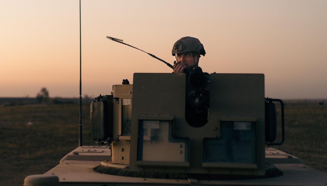 Senior Airman Anthony Wachob, 821st Contingency Response Group first in security team leader, radios in from a defensive fighting position while on perimeter watch at Qayyarah West Airfield, Iraq, Nov. 17, 2016. The 821st CRG is highly-specialized in training and rapidly deploying personnel to quickly open airfields and establish, expand, sustain and coordinate air mobility operations in austere, bare-base conditions. (U.S. Air Force photo by Senior Airman Jordan Castelan)