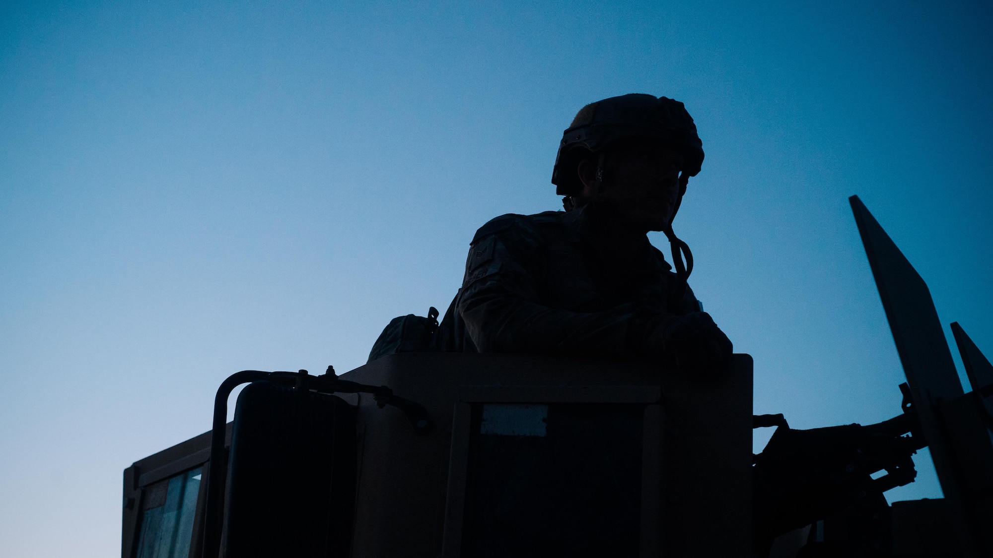 Senior Airman Johnathan Sorber, 821st Contingency Response Group first in security team member, scans the horizon while traveling to a defensive fighting position while on perimeter watch at Qayyarah West Airfield, Iraq, Nov. 17, 2016. The 821st CRG is highly-specialized in training and rapidly deploying personnel to quickly open airfields and establish, expand, sustain and coordinate air mobility operations in austere, bare-base conditions. (U.S. Air Force photo by Senior Airman Jordan Castelan)