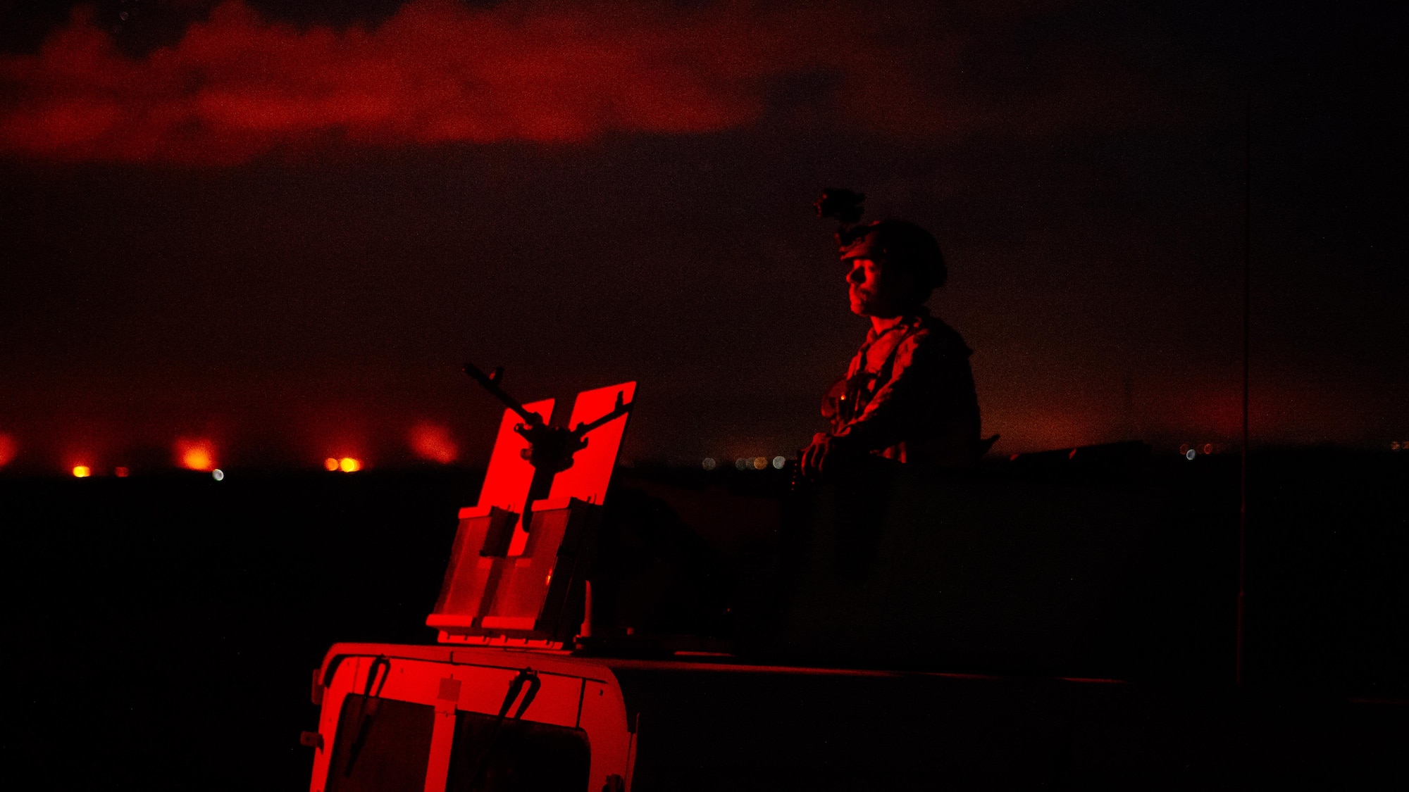 Senior Airman Johnathan Sorber, 821st Contingency Response Group first in security team member, scans the horizon while traveling to a defensive fighting position while on perimeter watch at Qayyarah West Airfield, Iraq, Nov. 17, 2016. The 821st CRG is highly-specialized in training and rapidly deploying personnel to quickly open airfields and establish, expand, sustain and coordinate air mobility operations in austere, bare-base conditions. (U.S. Air Force photo by Senior Airman Jordan Castelan)