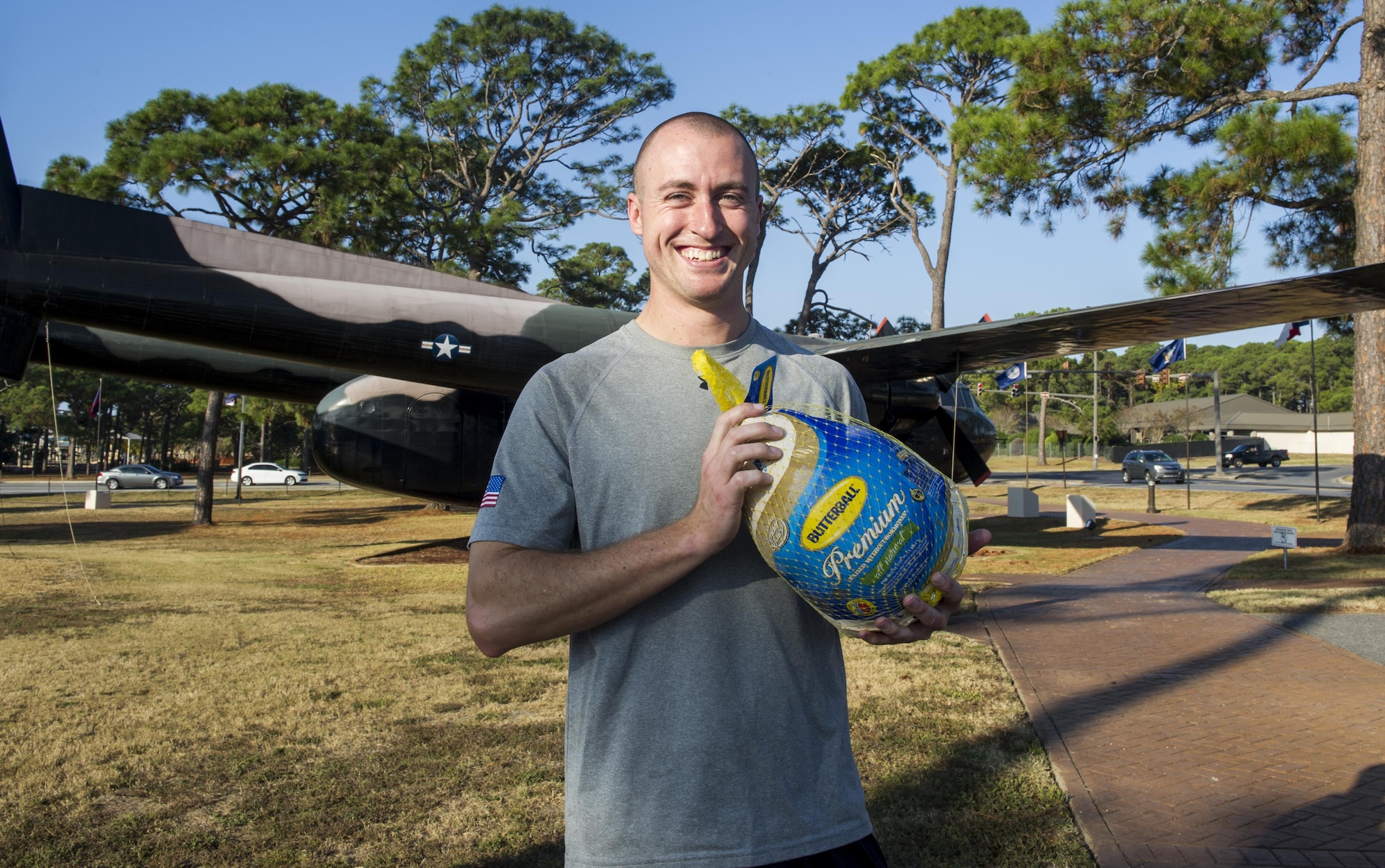 Capt. Aaron Thomas, a flight surgeon with the 1st Special Operations Support Squadron, stands with the turkey he won during the Turkey Trot Poker Run 5K for being the top male runner at Hurlburt Field, Fla., Nov. 18, 2016. Prizes included turkeys, speakers and gift certificates, and were given to the best male and female runner, the best poker hand and raffle winners. (U.S. Air Force photo by Airman 1st Class Isaac O. Guest IV)