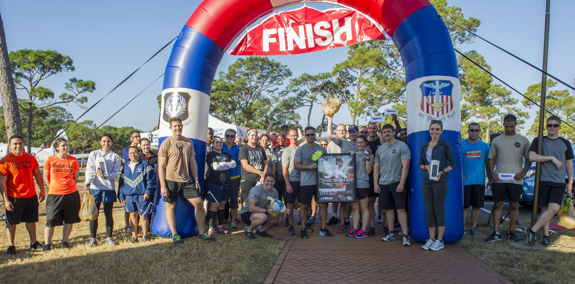 Air Commandos stand at the finish line of the Turkey Trot Poker Run 5K at Hurlburt Field, Fla., Nov. 18, 2016. Airmen were given random playing cards at different stations throughout the run and the best hand was awarded at the end. The 1st Special Operations Force Support Squadron fitness staff hosts monthly fitness events on base to give Airmen a chance to exercise in a competitive and fun environment. This month’s event celebrated the Thanksgiving holiday season (U.S. Air Force photo by Airman 1st Class Isaac O. Guest IV)