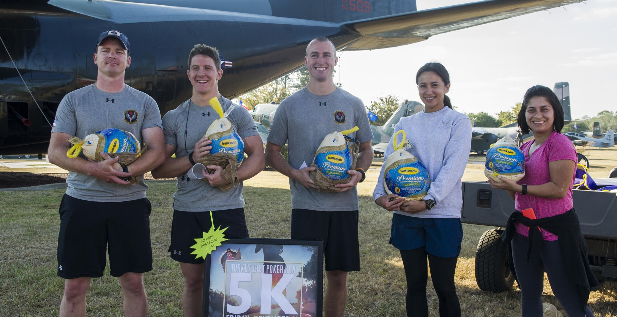 Air Commandos stand with the prizes they earned during the Turkey Trot Poker Run 5K at Hurlburt Field, Fla., Nov. 18, 2016. Prizes included turkeys, speakers and gift certificates, and were given to the best male and female runner, the best poker hand and raffle winners. (U.S. Air Force photo by Airman 1st Class Isaac O. Guest IV)