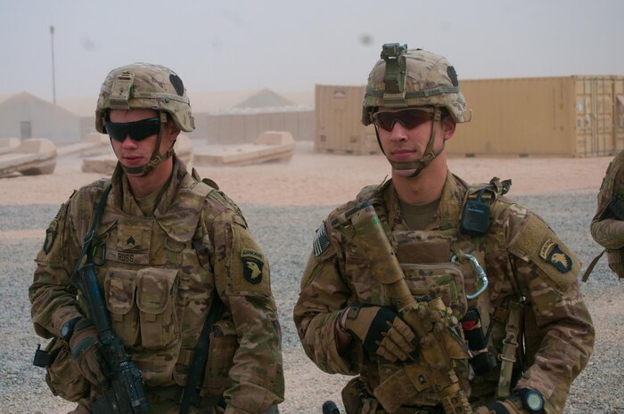 Army Sgts. Logon Ross, left, and Addison Owen, both with Bravo Company, 1st Battalion, 26th Infantry Regiment, walk through the U.S compound at the Qayyarah West Airfield, Iraq, Nov. 1, 2016. Owen is an infantryman at the base and is on his second deployment to Iraq. On his first deployment in the city of Basra during 2010-2011, Owen was wounded when an explosively formed penetrator hit his vehicle. Army photo by 1st Lt. Daniel Johnson
