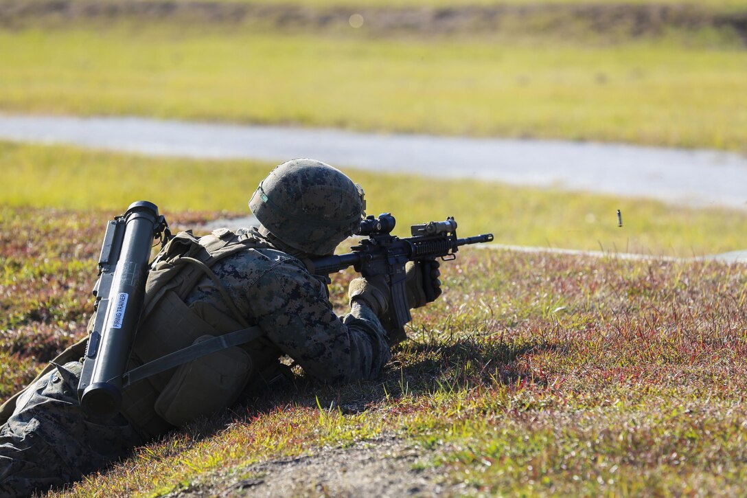 Lance Cpl. William Finn fires an M4 Carbine rifle during a training exercise at Camp Lejeune, N.C., Nov 16, 2016. The Marines practiced squad-sized movements to maintain unit readiness for their upcoming Integrated Training Exercise at the Marine Corps Air Ground Combat Training Center in Twentynine Palms, California. Finn is a grenadier with 1st Battalion, 8th Marine Regiment.  (U.S. Marine Corps Photo by Lance Cpl. Jon Sosner)