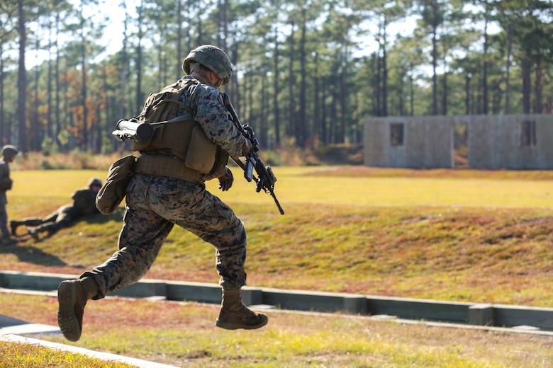 Lance Cpl. William Finn hurdles a trench during a training exercise at Camp Lejeune, N.C., Nov 16, 2016. The Marines practiced squad-sized movements in order to maintain unit readiness for their upcoming Integrated Training Exercise at the Marine Corps Air Ground Combat Training Center in Twentynine Palms, California. Finn is a grenadier with 1st Battalion, 8th Marine Regiment.  (U.S. Marine Corps Photo by Lance Cpl. Jon Sosner)